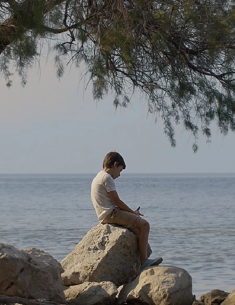 Sat down child on rock